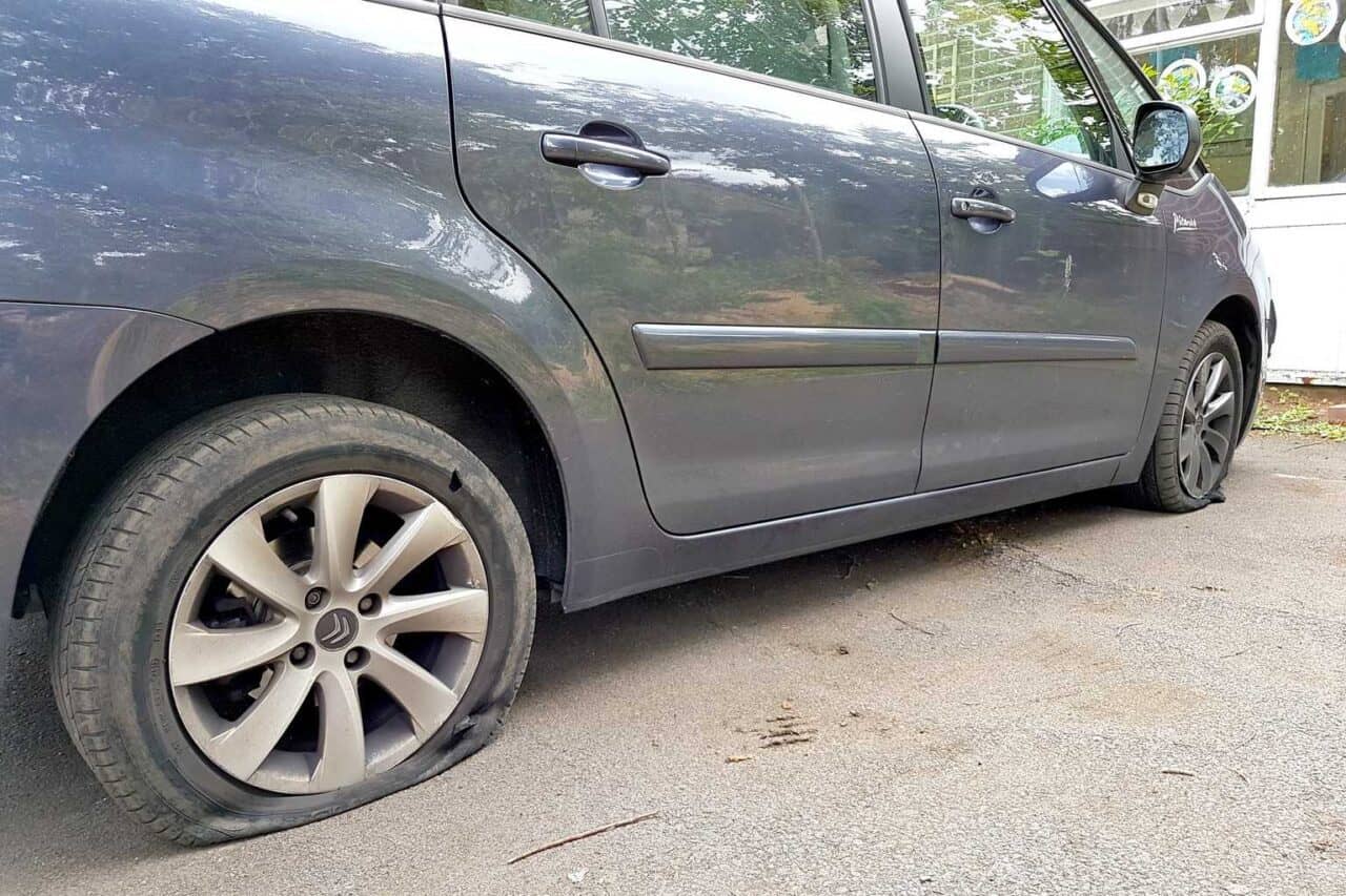 A car parked on the side of a road