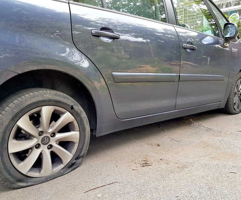 A car parked on the side of a road