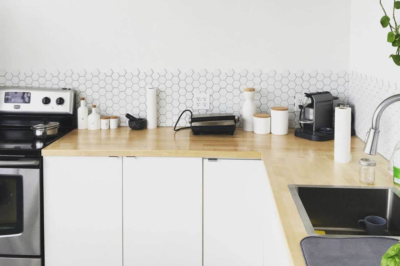 A stove top oven sitting inside of a kitchen