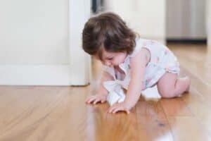 A small child sitting on the floor