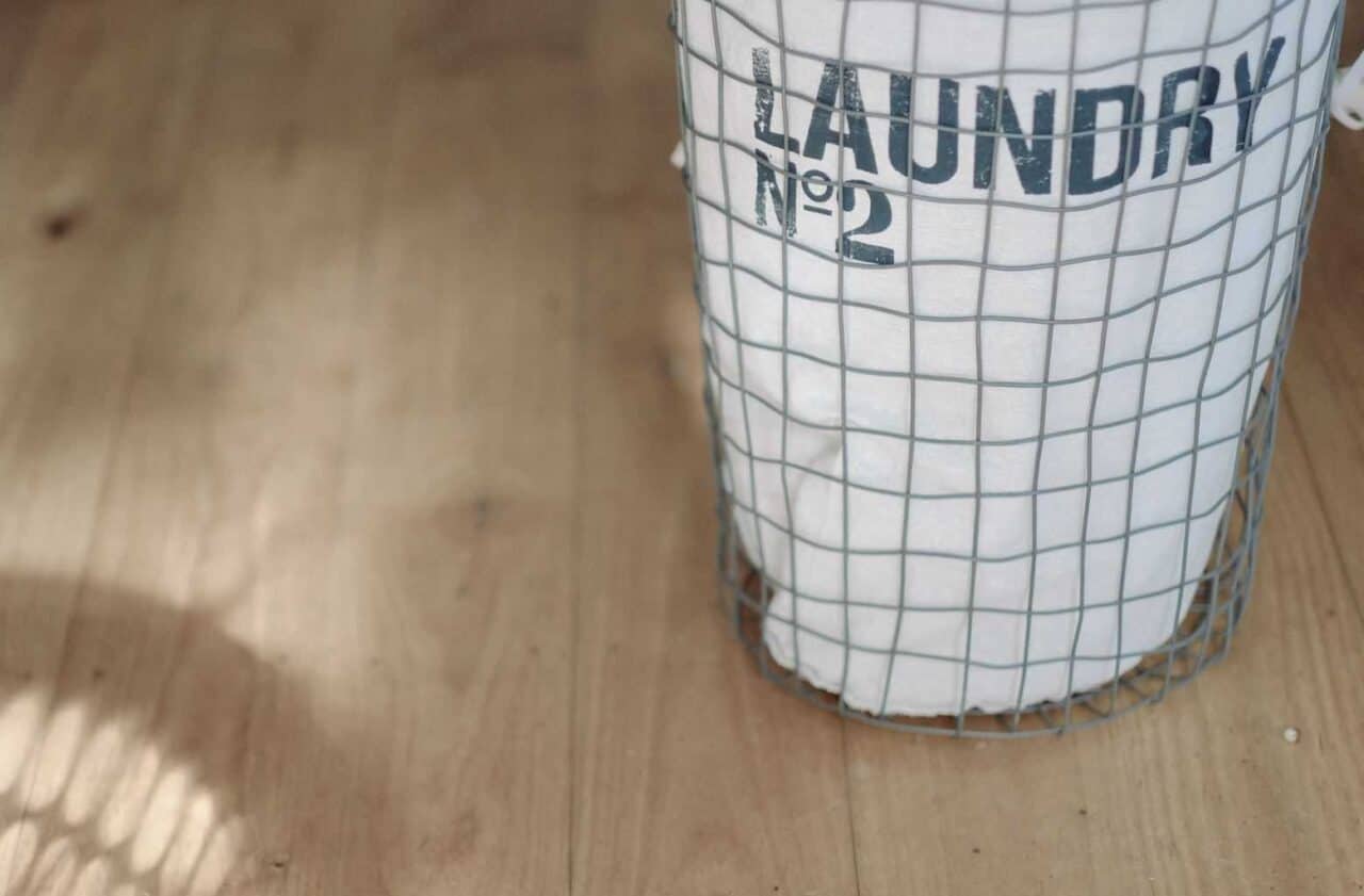 A cup on a counter, with Laundry and Laundry room