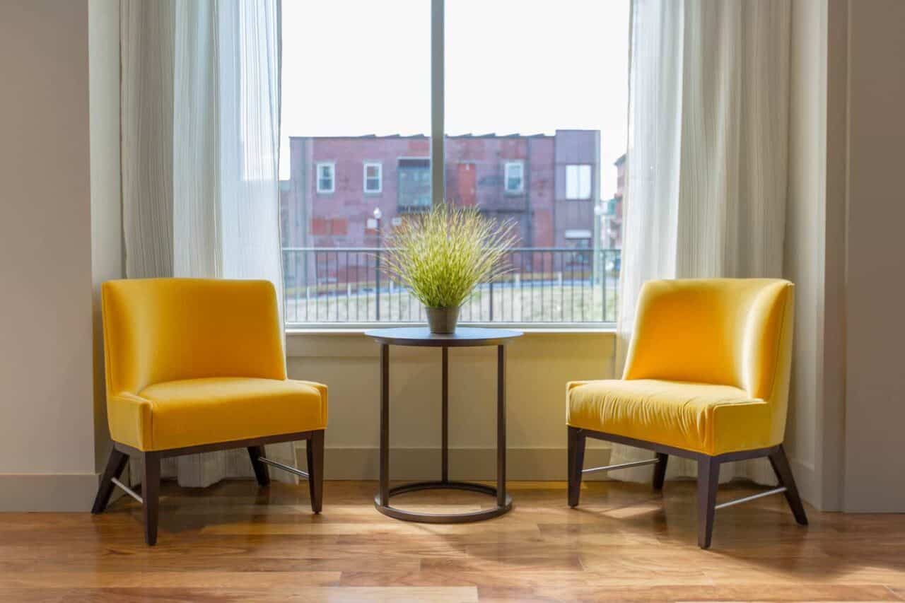 A dining room table in front of a window