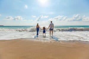 A child standing on a beach