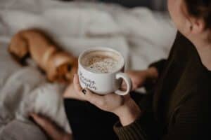 A person drinking from a coffee cup