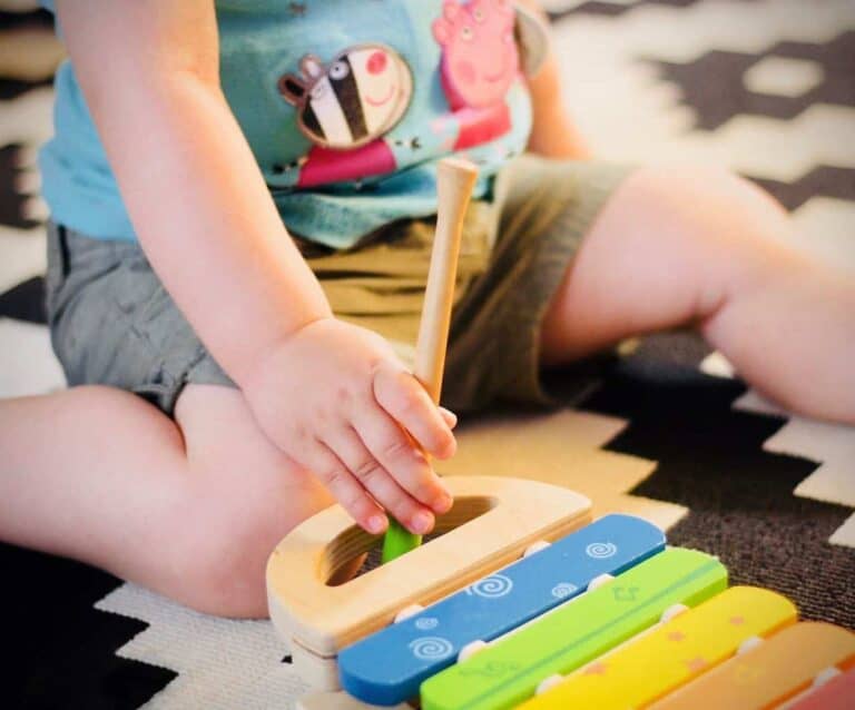 A small child sitting on a table