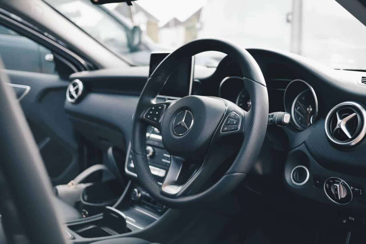 A car parked in front of a mirror