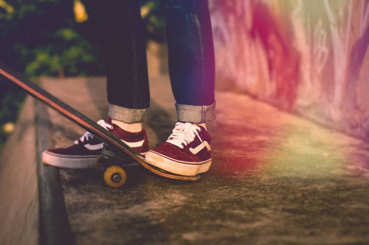 A pair of feet wearing blue shoes