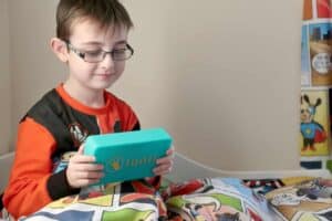 A young boy holding a book