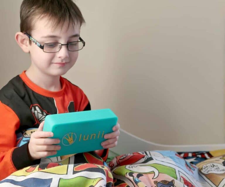 A young boy holding a book