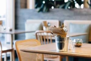 A cup of coffee sitting on top of a wooden table