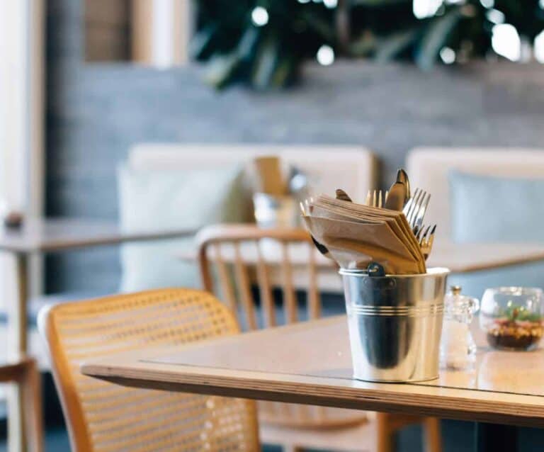 A cup of coffee sitting on top of a wooden table