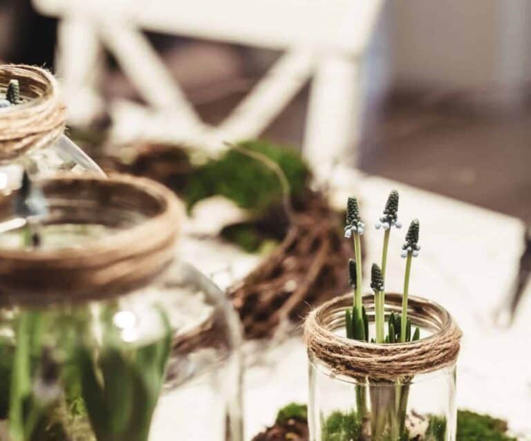 A vase sitting on top of a wooden table