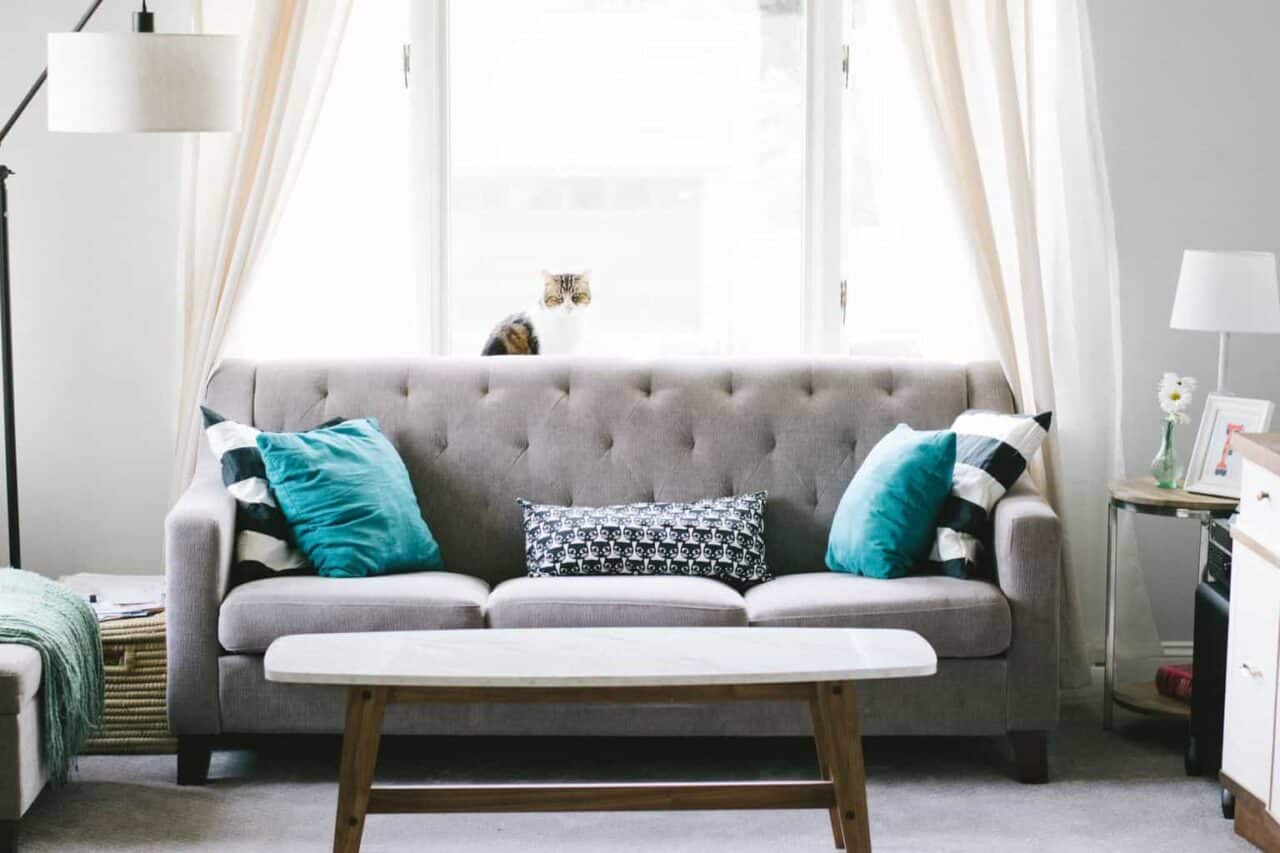 A living room filled with furniture and a window