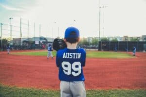 A young boy holding a baseball bat on a field