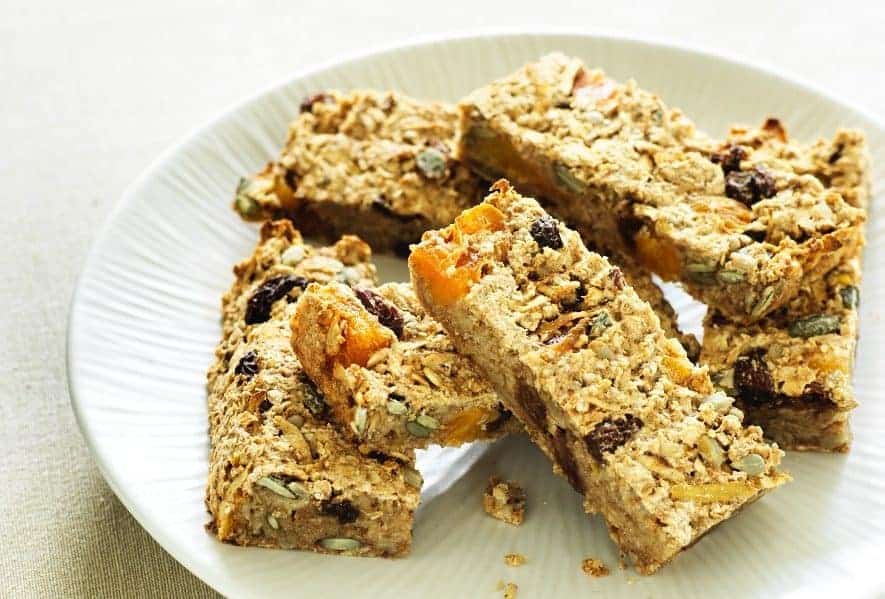 A piece of bread on a plate, with Muesli