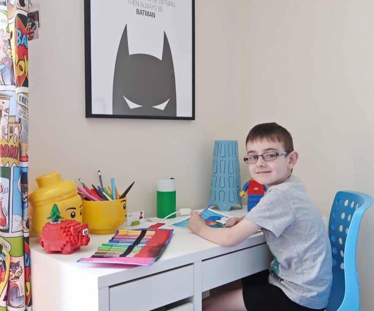 A young boy sitting at a table