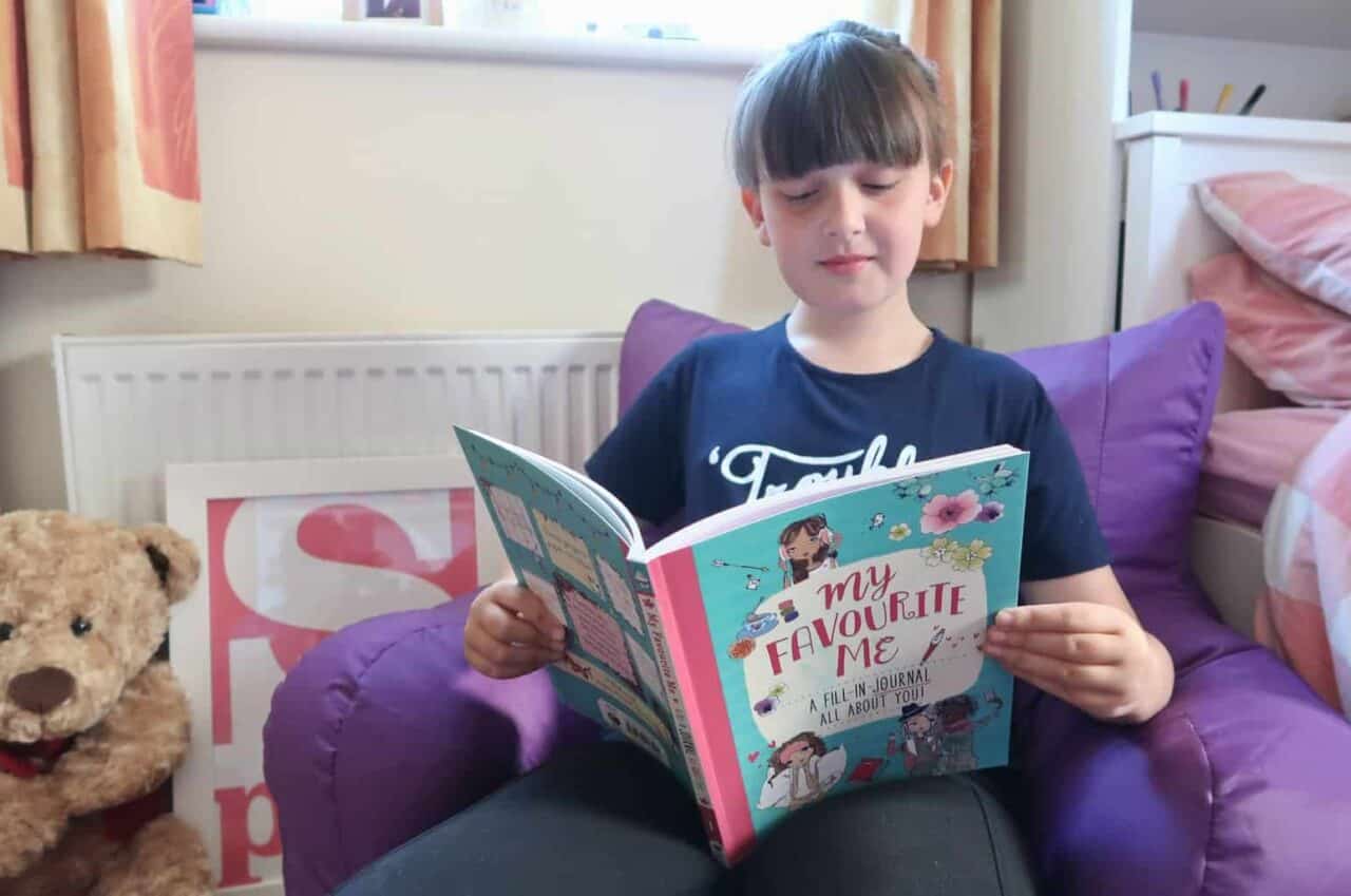 A young boy is reading a book