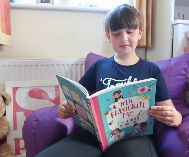 A young boy is reading a book