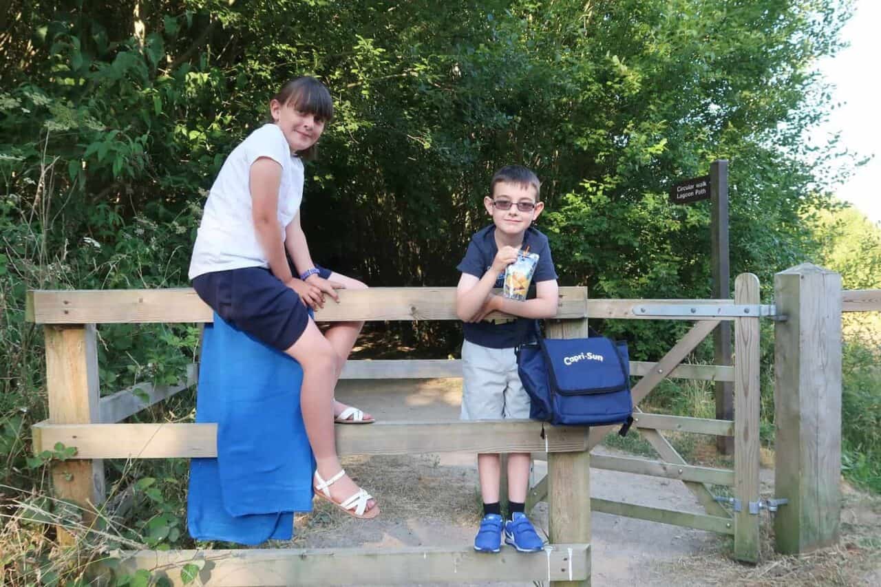 A man and a woman sitting on a bench