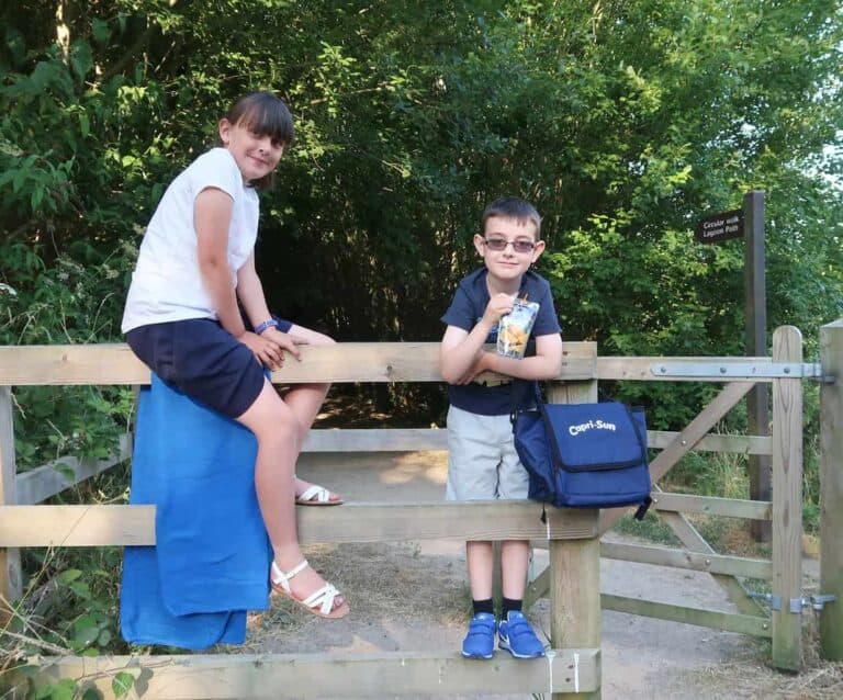 A man and a woman sitting on a bench