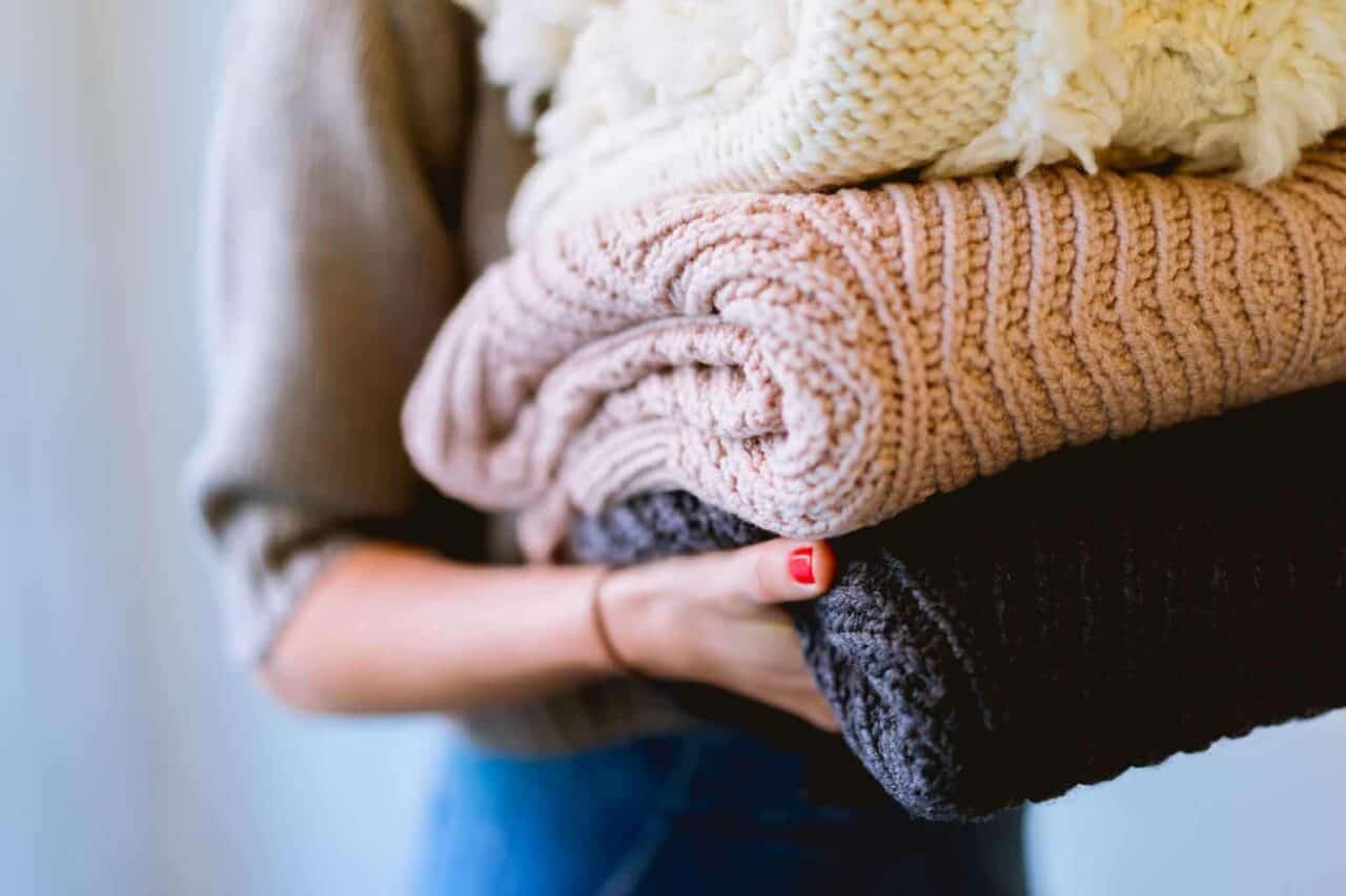 A person holding a stuffed animal