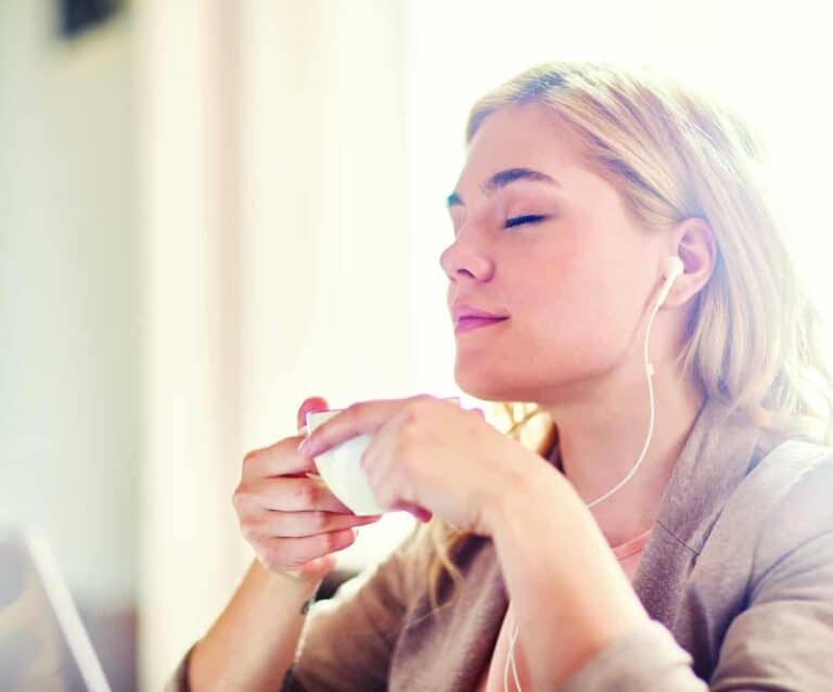 A woman eating a donut