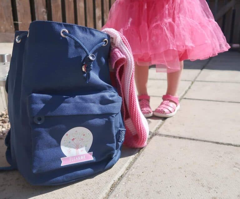 A woman holding a bag of luggage