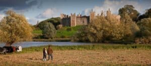 A castle on top of a grass covered field