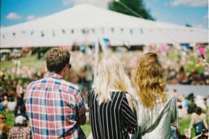 A group of people standing next to a person