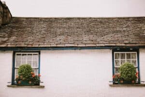 A house with bushes in front of a building