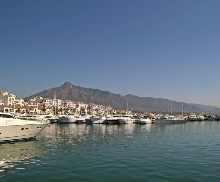 A boat is docked next to a body of water