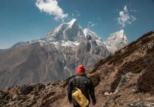 A man standing on a rocky hill