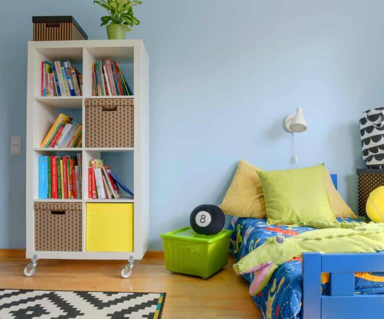 A bedroom with a book shelf