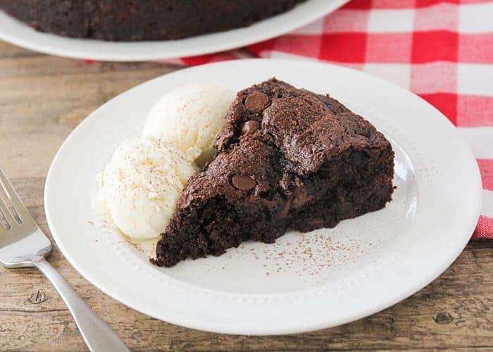 A piece of cake on a plate, with Chocolate and Gingerbread