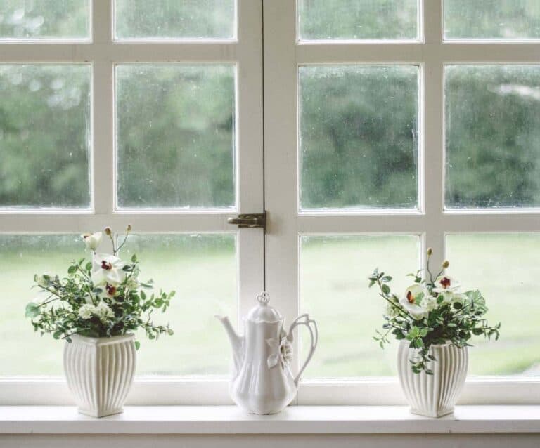 A vase of flowers on a sunny window