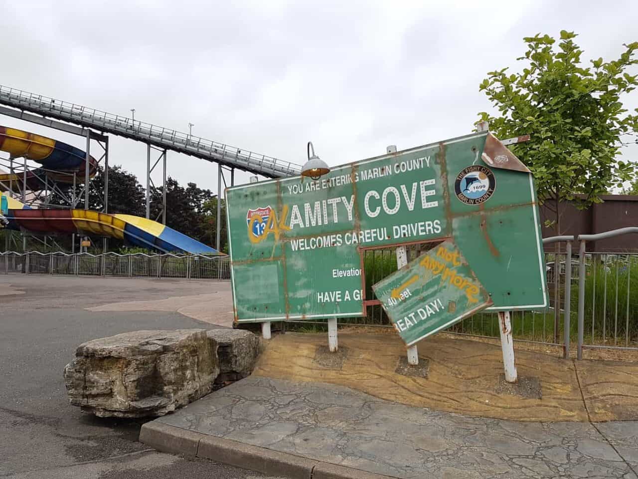 A sign on the side of a fence