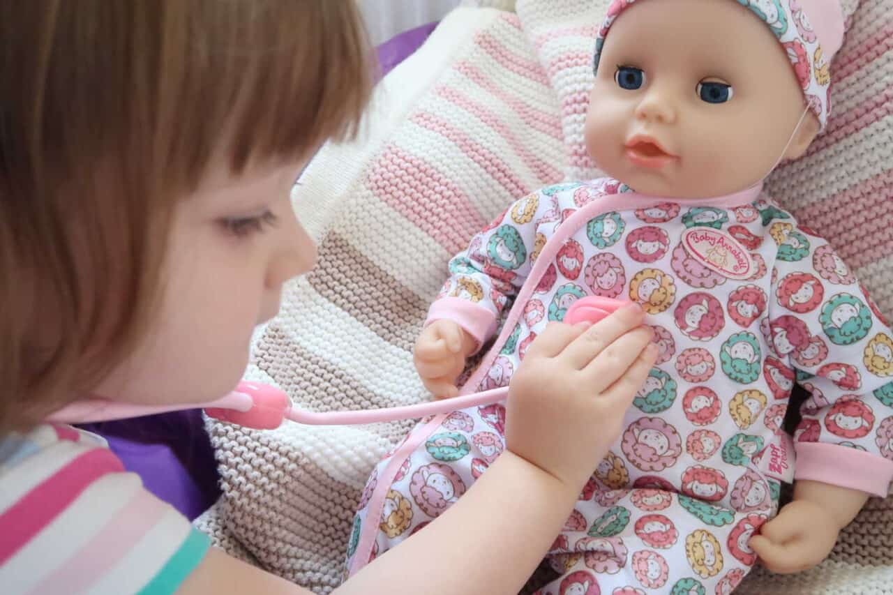 A close up of a person holding a baby