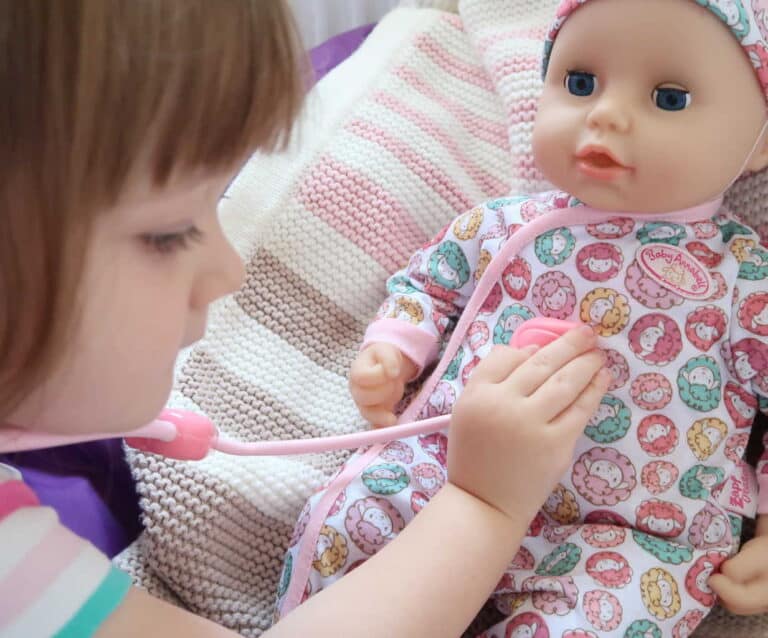 A close up of a person holding a baby