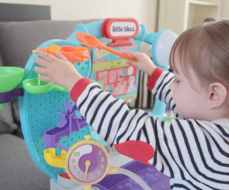 A small child playing with STEM toy