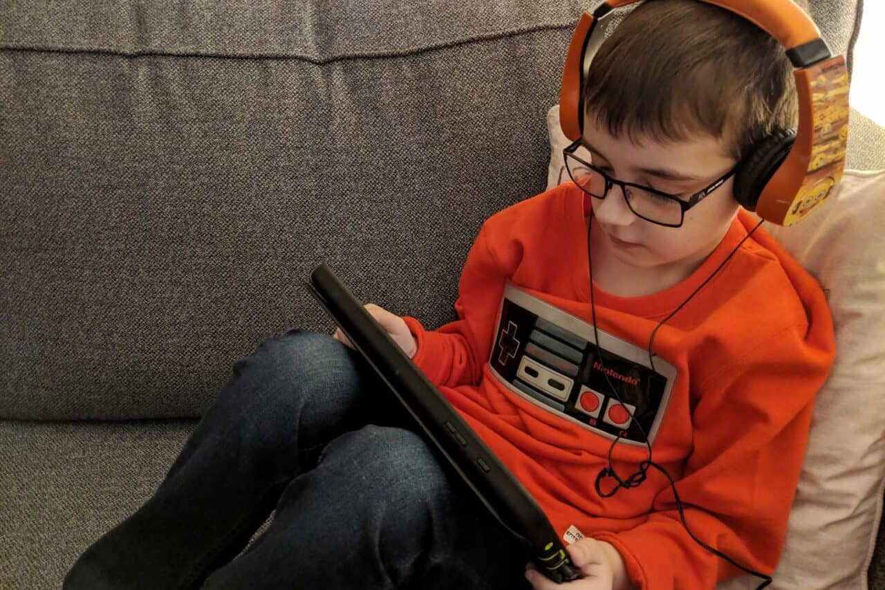 A boy sitting and looking at the camera