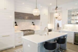 A kitchen with a sink and a mirror