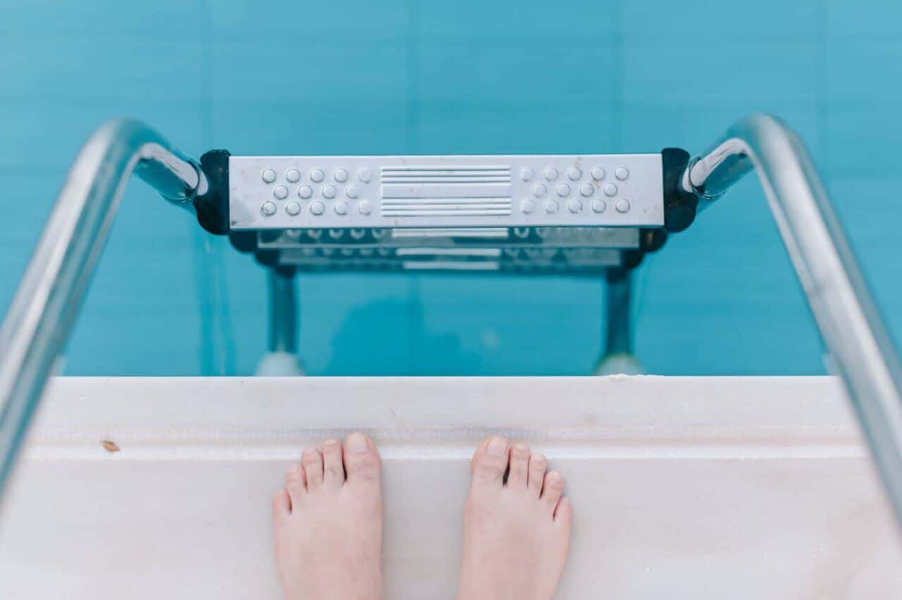 A close up of pink tub and sink