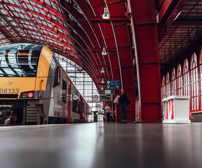 A train is parked on the side of a building