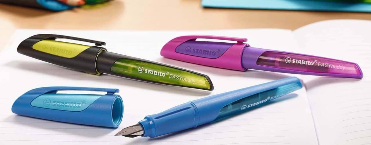 A table that has a toothbrush in a pen