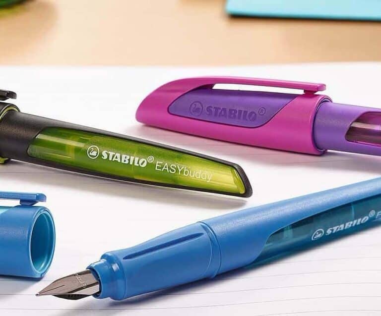 A table that has a toothbrush in a pen