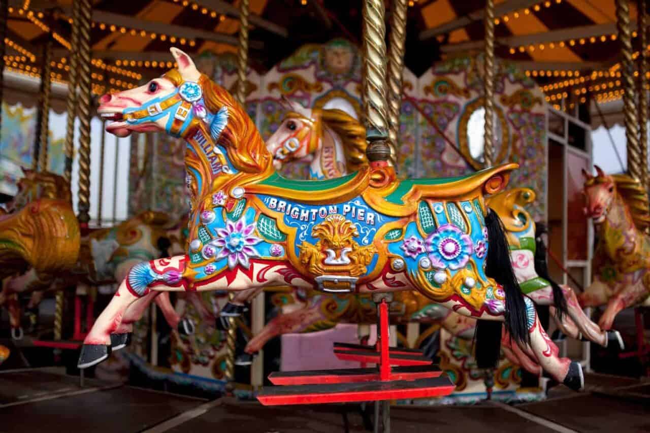 A person standing in front of a carousel