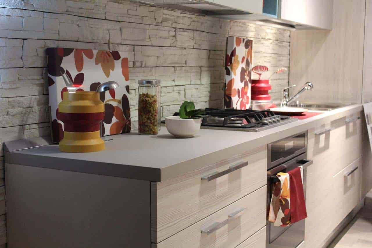 A stove top oven sitting inside of a kitchen