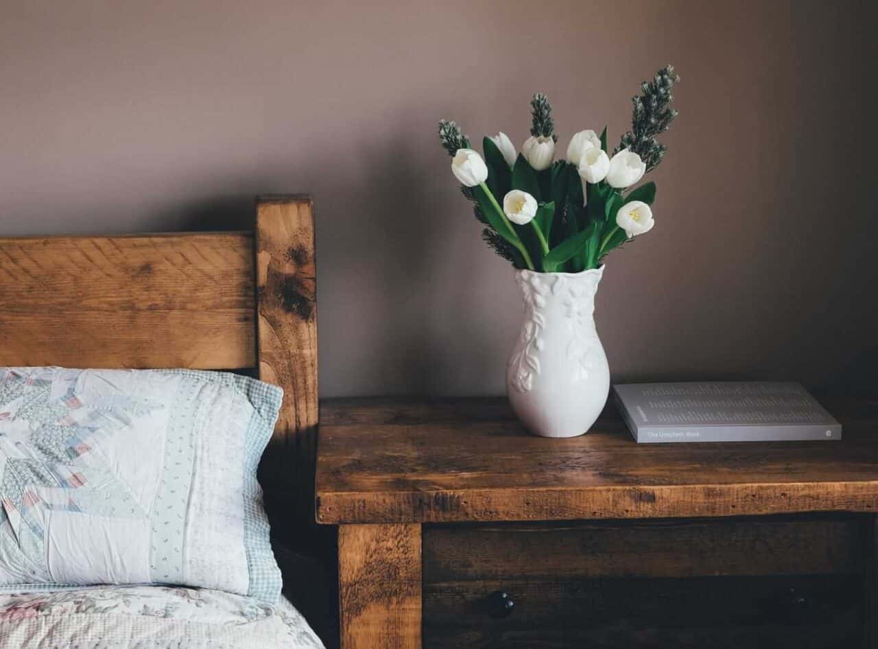 A vase of flowers sitting on top of a wooden table