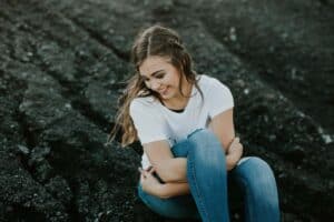 A girl sitting on a bench