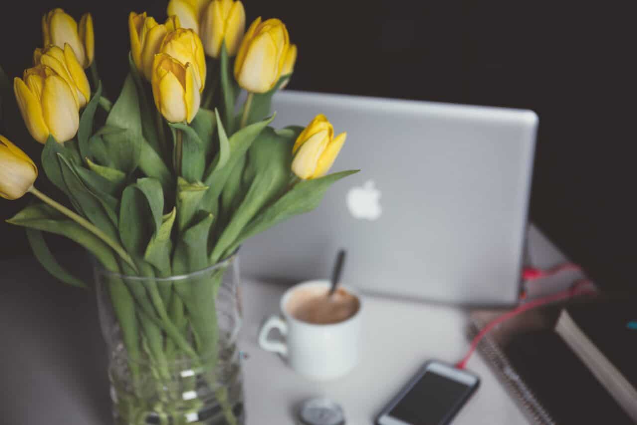 A vase filled with flowers sitting on a table